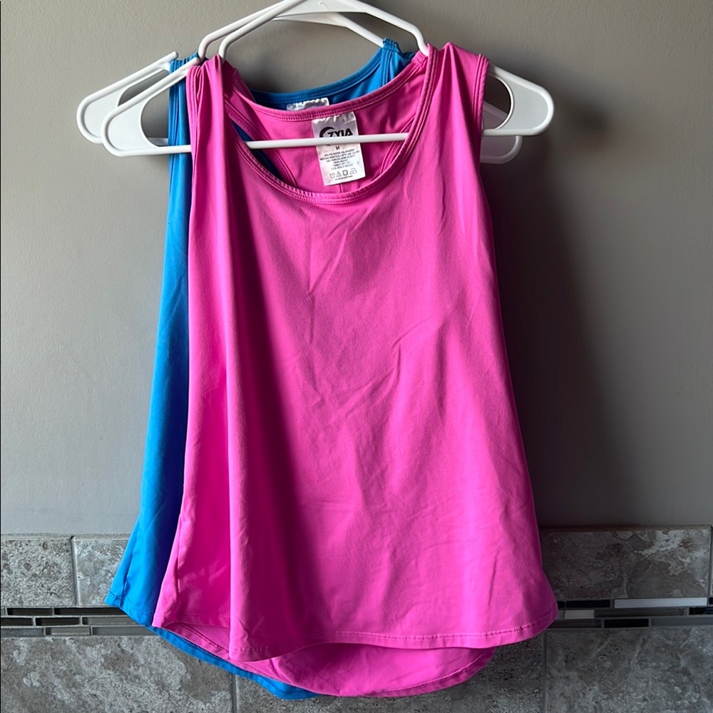 Zyia Women's vented open back tanks in pink and blue.